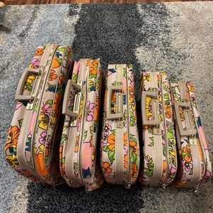 1970s vintage floral suitcases.  set of 5